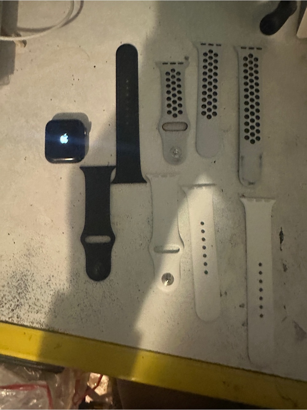 Apple Watch Series 5 with Black Sport Band and White Perforated/Standard Bands